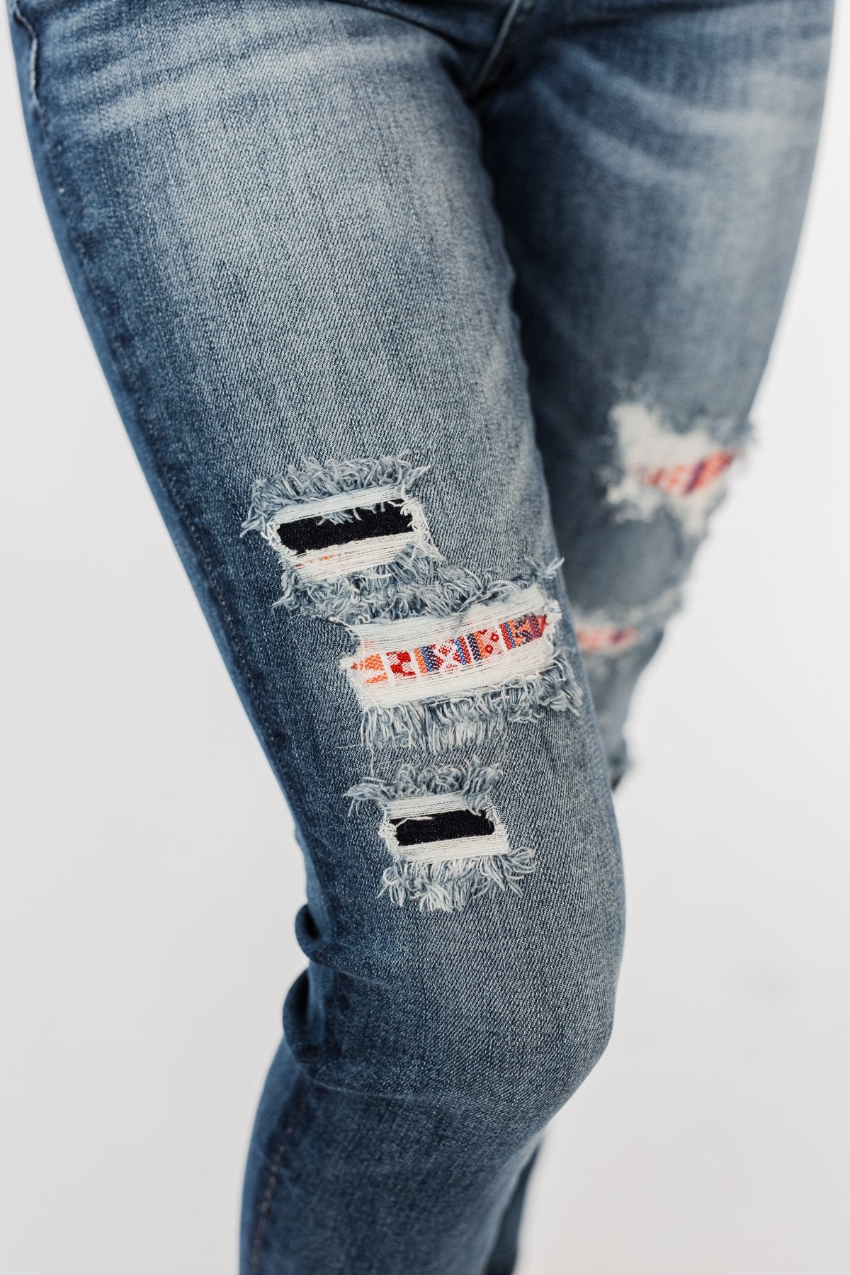 distressed jeans with ankara patches