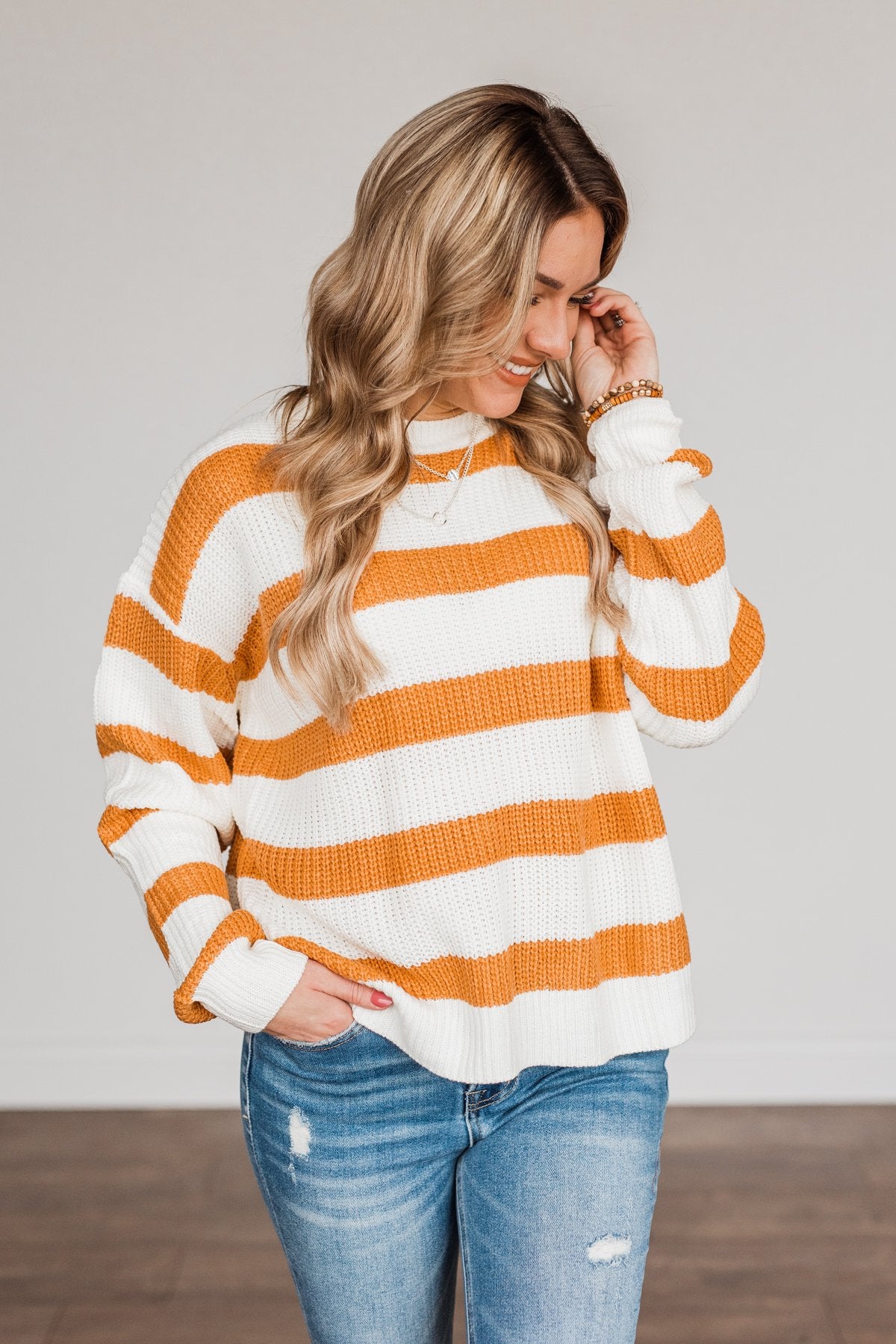 Orange and white striped sweater shop