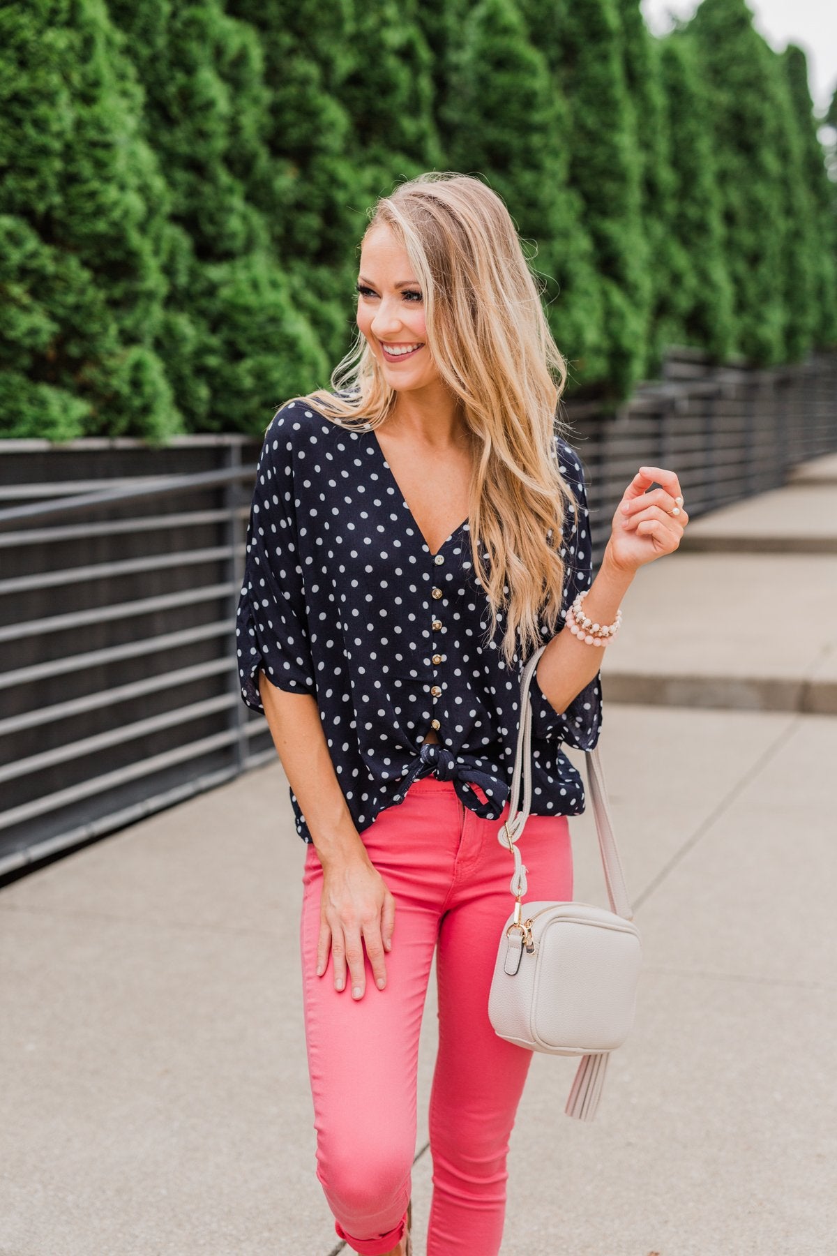 pink top with black polka dots