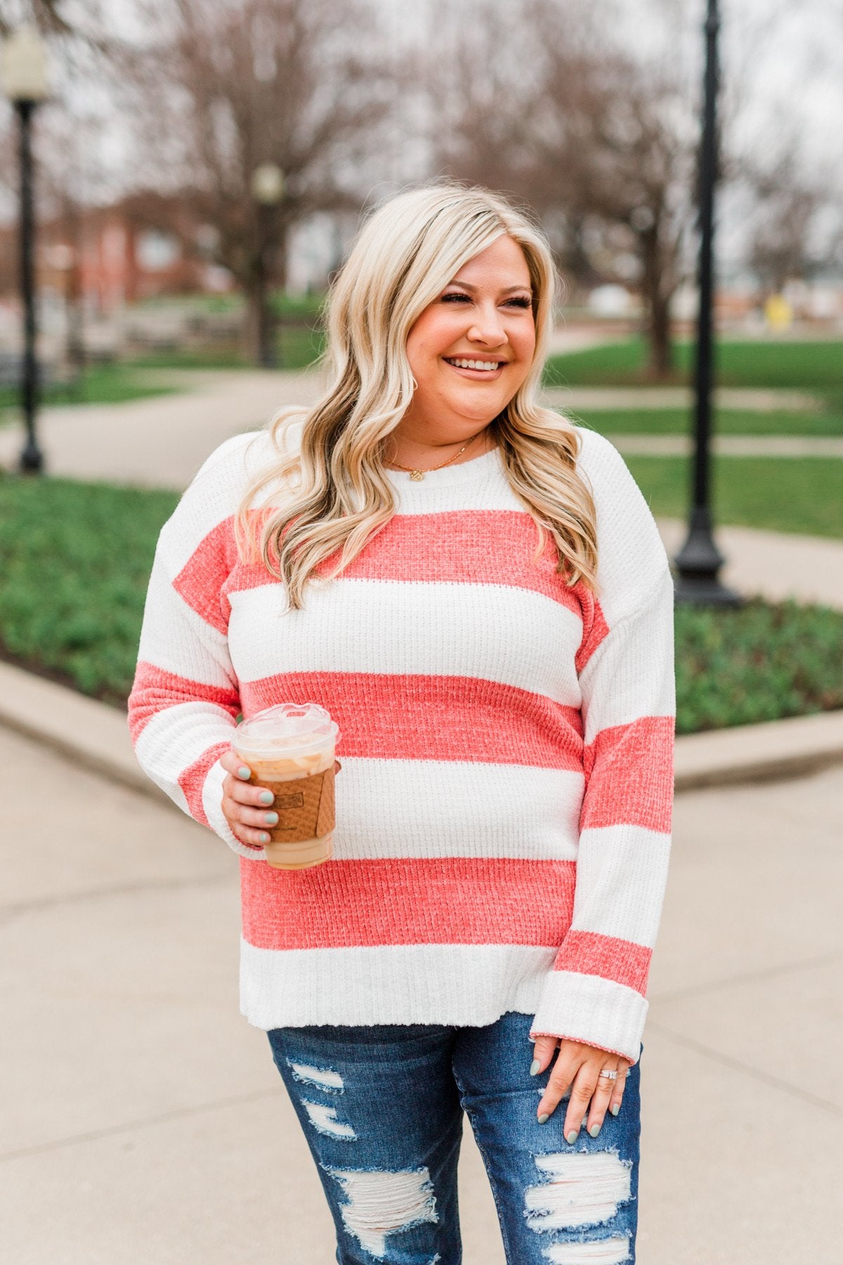 striped sweater and red jeans